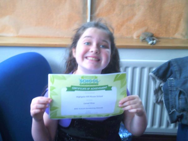 A proud learner from Highgate Hill House school at Whitstone near Holsworthy, with her RHS gardening certificate.
