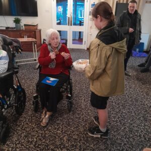 Learners from Highgate Hill House School visit St Anne’s Residential Home to spread festive cheer, sharing mince pies and handmade Christmas cards with residents as part of a community engagement visit in December.