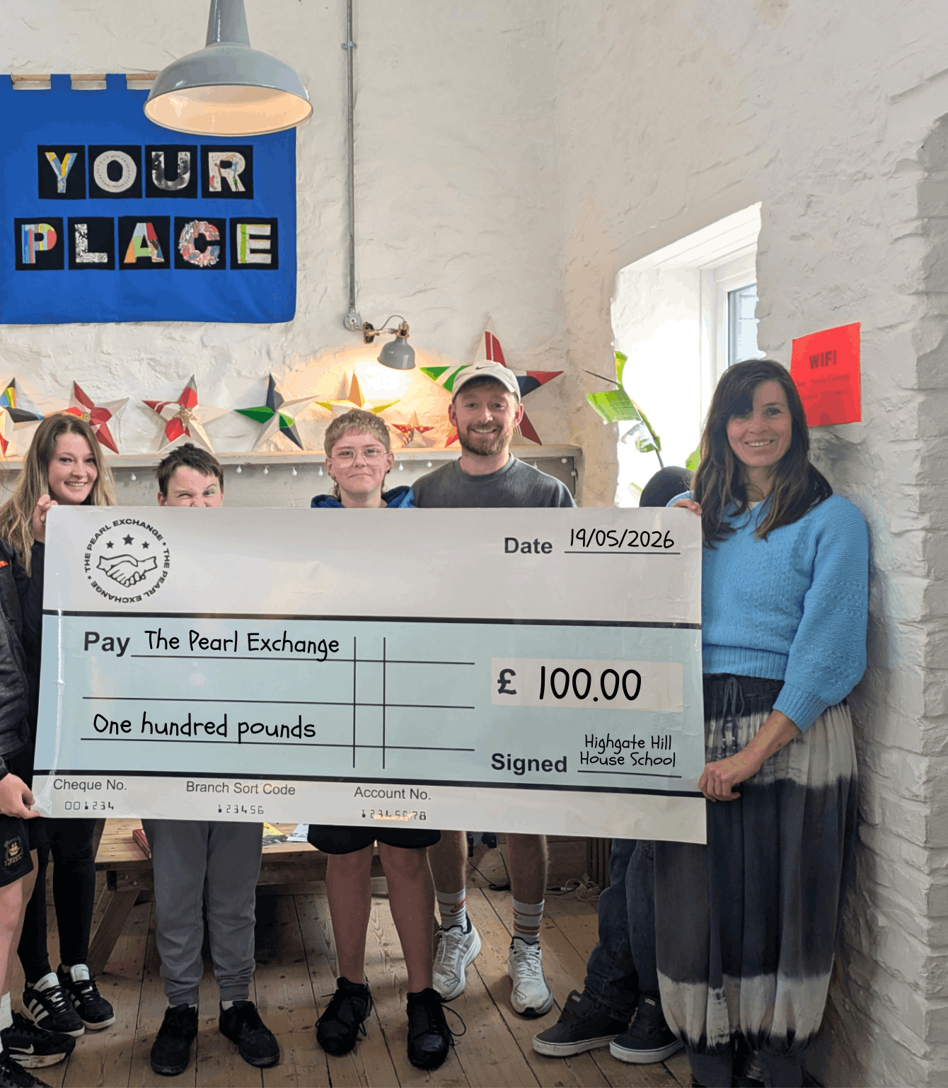 Crackington Class proudly delivered the £100 they raised from their hot chocolate stand to the Pearl Exchange, presenting their donation and celebrating the success of their fundraising efforts.